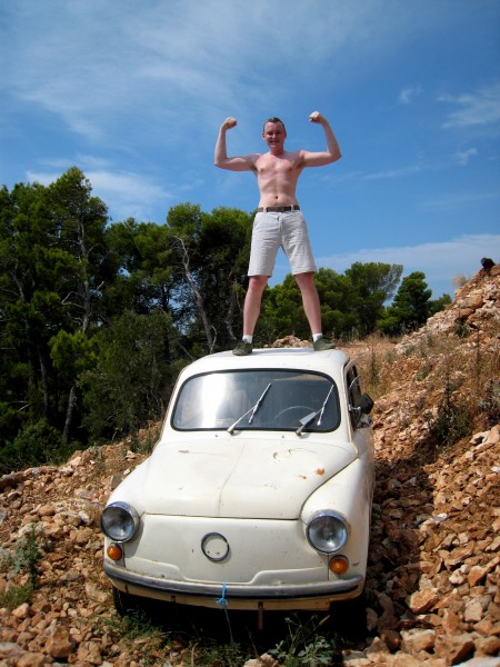 A man ontop a white Zastava 750 or 850