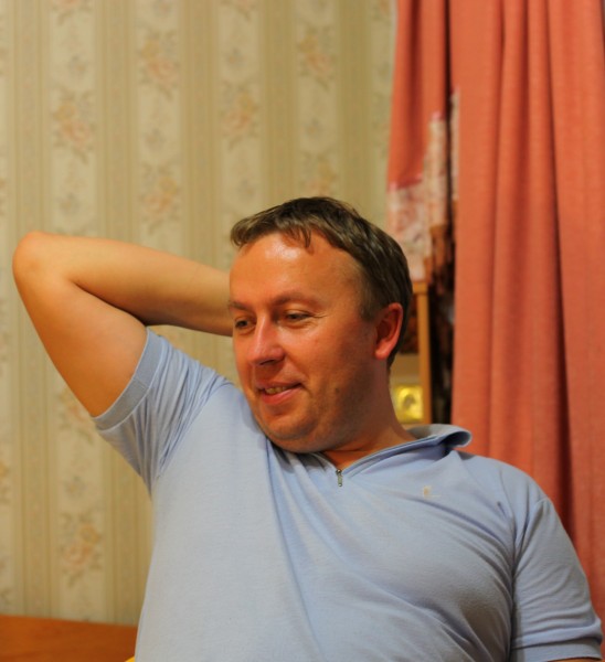 A smiling catholic man