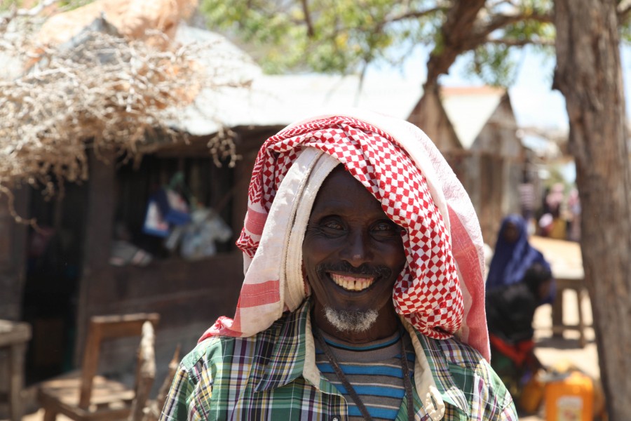 A Somali man smiles for the camera in the town of Ragaele shortly after Burundian troops, belonging to the African Union Mission in Somalia, captured the town from Al Shabab militants on September 30. (15230352860)