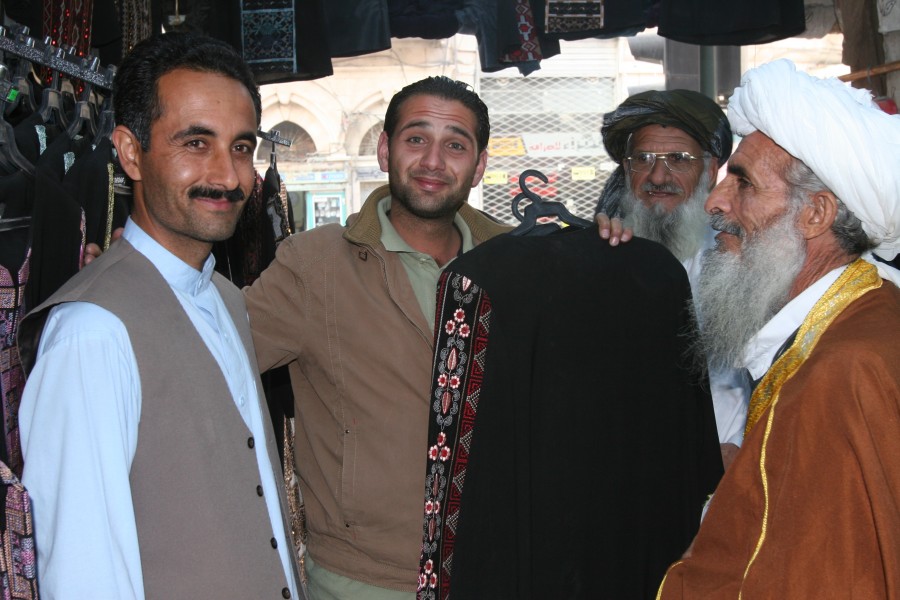 Abdul Ali Shamsi, left, an Afghan security advisor, and other Afghans attending the Voices of Religious Tolerance (VORT) conference do some shopping in downtown Amman, Jordan, April 21, 2011 110421-M-GW940-124