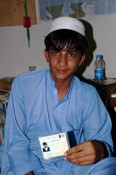 Afghan voter shows his voter card