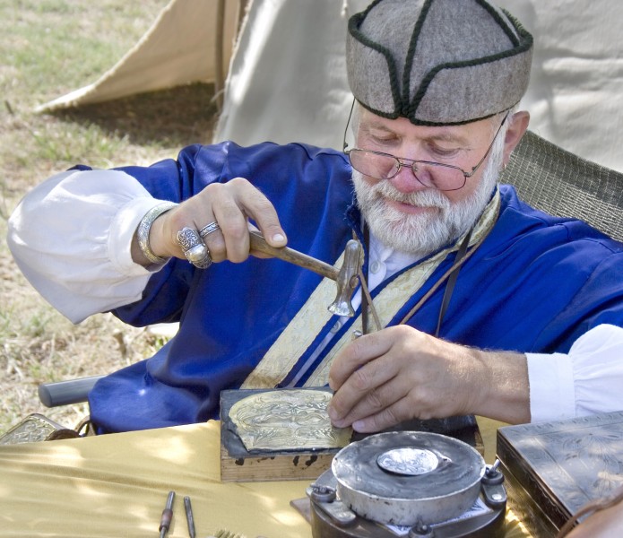 Ancient Hungarian - traditional coppersmith master at work