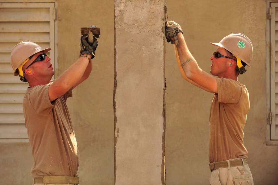 Defense.gov News Photo 110112-N-1755G-129 - U.S. Navy Petty Officer Robert DeLuca left and Petty Officer Naethan Clark both assigned to Naval Mobile Construction Battalion 74 Detail Horn of