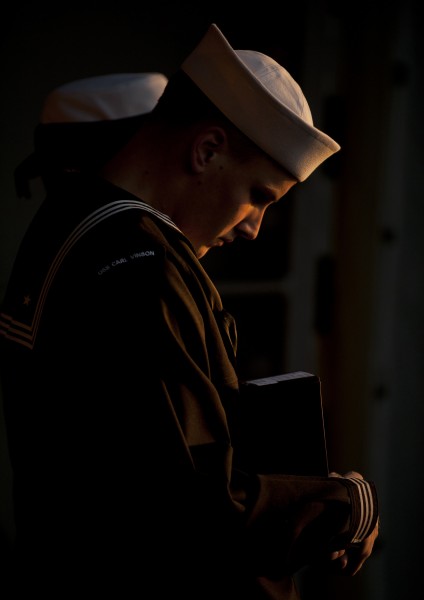Flickr - Official U.S. Navy Imagery - A lone Sailor bows his head in prayer.