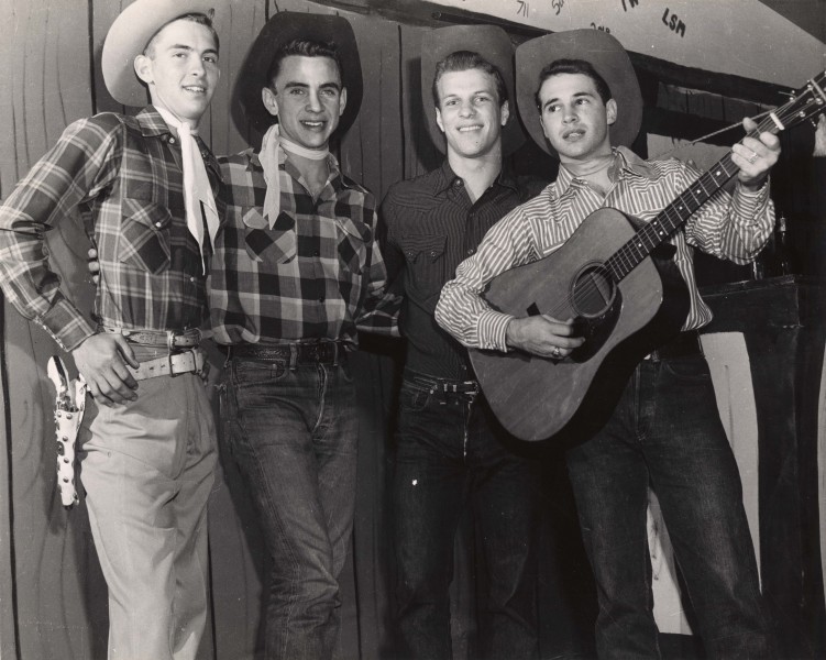 Four students with guitar