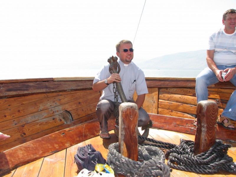 A Catholic priest on a boat on the Galilean Sea (Lake) in Israel (where Jesus Christ preached), picture 5