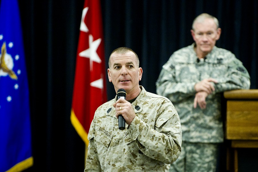 Gen. Martin E. Dempsey listens during a town hall meeting on Ramstein Air Base, Germany, Dec. 19, 2011