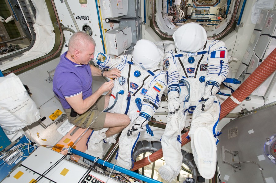 ISS-51 Oleg Novitskiy works on Sokol suits inside the Unity module