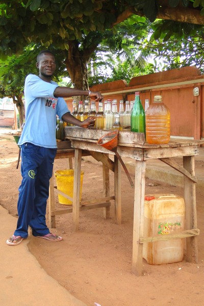 Man Sells Petrol on Street - Abomey - Benin