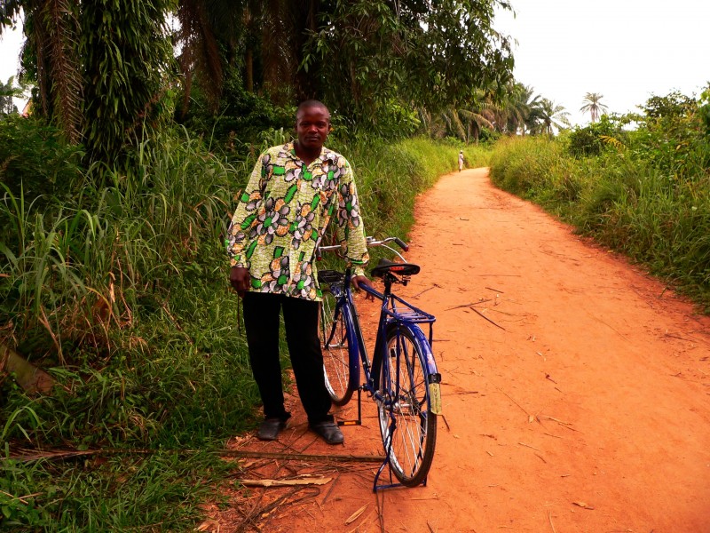 Man with a bicycle - Basankusu by Francis Hannaway