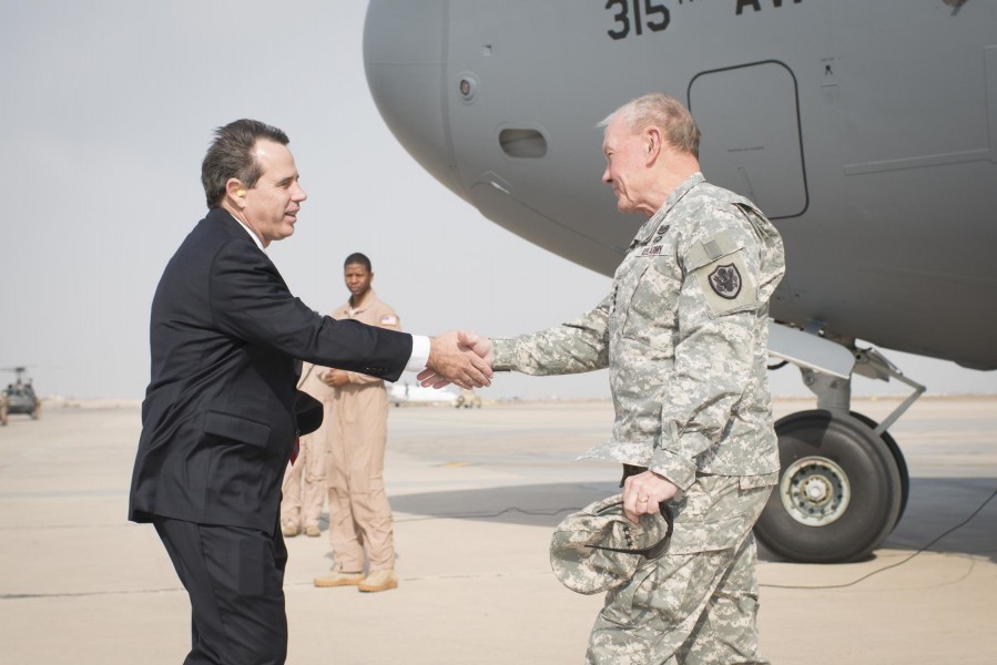 Stuart E. Jones greets Gen. Martin E. Dempsey at the airport in Baghdad, 2014