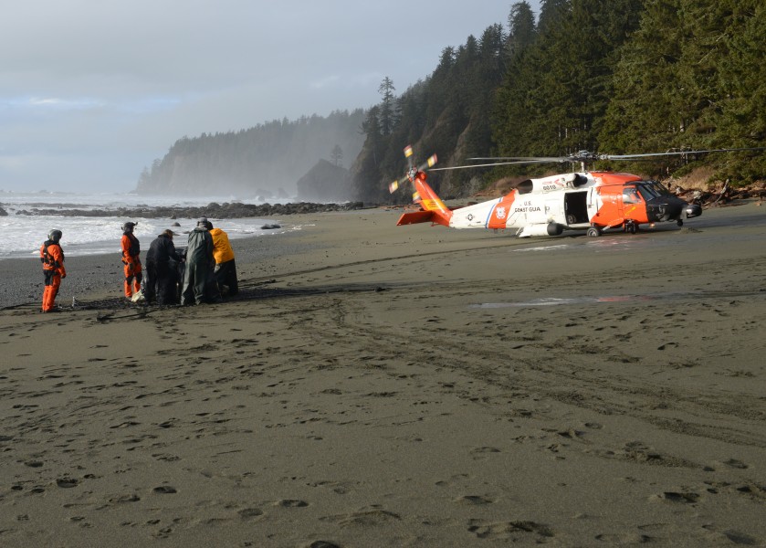 The Coast Guard helps remove trash from a beach near Neah Bay, Wash. 160122-G-KL864-854