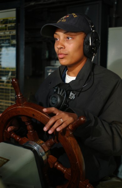 US Navy 030303-N-5319A-009 Seaman Shawnrayell Foster drives the 609-foot amphibious dock landing ship USS Comstock (LSD 45) during her 4-hour deck watch on the bridge