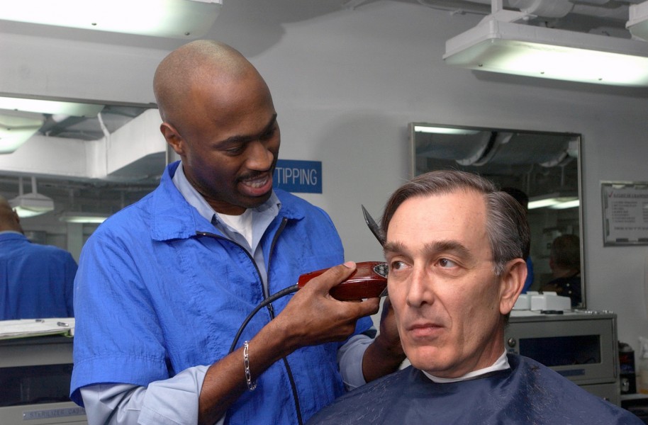 US Navy 030328-N-4953E-003 Vice Admiral Scott A. Fry, Commander Sixth Fleet receives a haircut from Ship's Serviceman 3rd Class Tyrone Workman aboard USS Harry S. Truman (CVN 75)