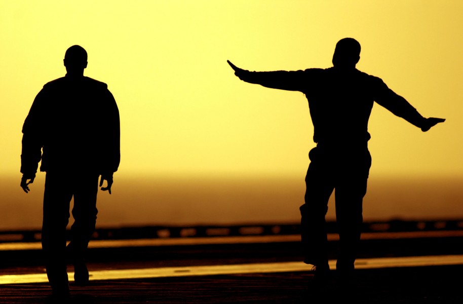US Navy 030812-N-6213R-328 Sailors enjoy a free moment on the flight deck aboard USS John C. Stennis (CVN 74) prior to night flight operations
