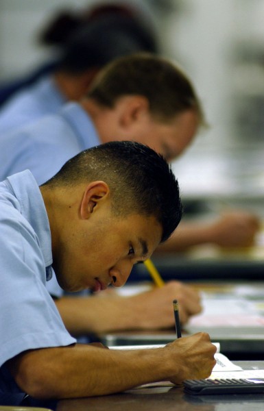 US Navy 030904-N-6213R-021 Sailors aboard the nuclear powered aircraft carrier USS John C. Stennis (CVN-74) take the 1st Class Petty Officer exam on the ship's mess decks