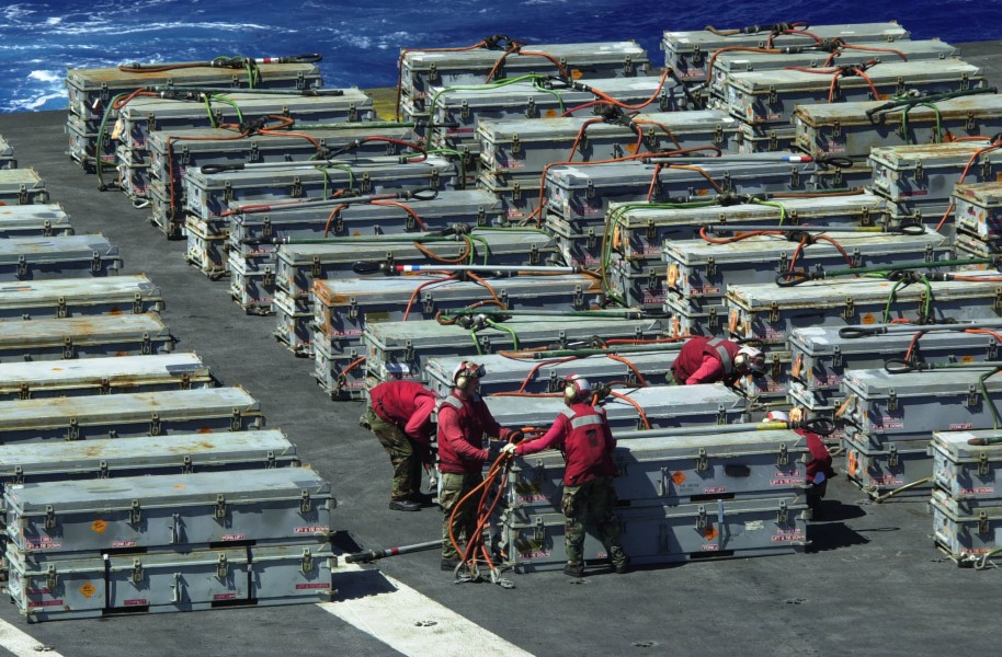 US Navy 031023-N-9319H-002 During an ammunition offload, Aviation Ordnanceman prepare crates of ordnance to be transported from USS Nimitz (CVN 68) to the USNS Kilauea (T-AE 26)