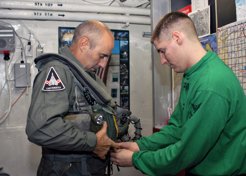 US Navy 031127-N-4669B-001 British Major General Graeme Lamb is fitted for his flight suit by Aircrew Survival Equipmentman 2nd Class Jeffery D. Schmidt