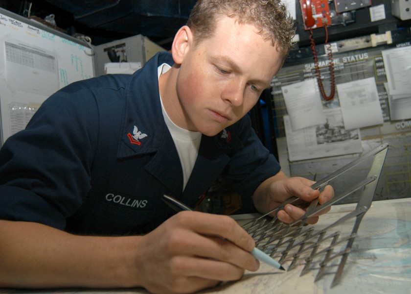 US Navy 040927-N-4565G-003 Aviation Warfare Systems Operator 2nd Class Jonathan Collins of Wildwood Florida, plots water space management for ships - edited.jpg