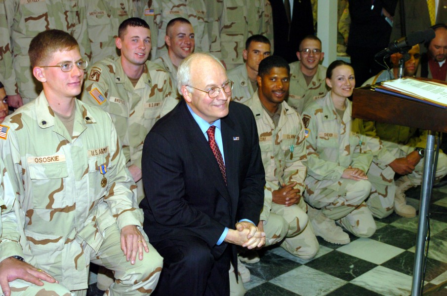 US Navy 041207-N-5608F-020 U.S. Vice President Dick Cheney takes a moment to pose with several service members in the dinning facility in Bagram, Afghanistan