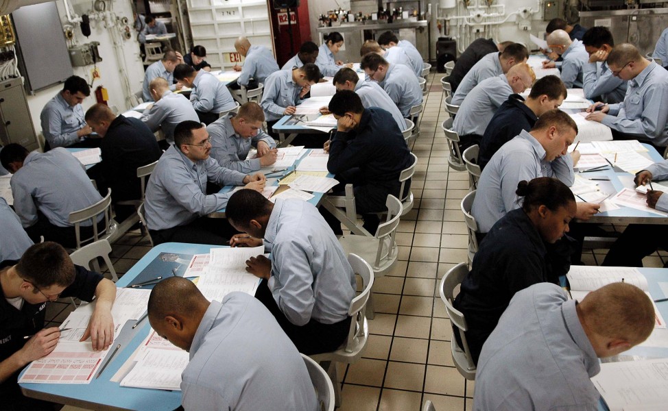 US Navy 060316-N-4166B-015 Sailors aboard the Nimitz-class aircraft carrier USS Abraham Lincoln (CVN 72) take the E-4 advancement exam on the forward mess decks