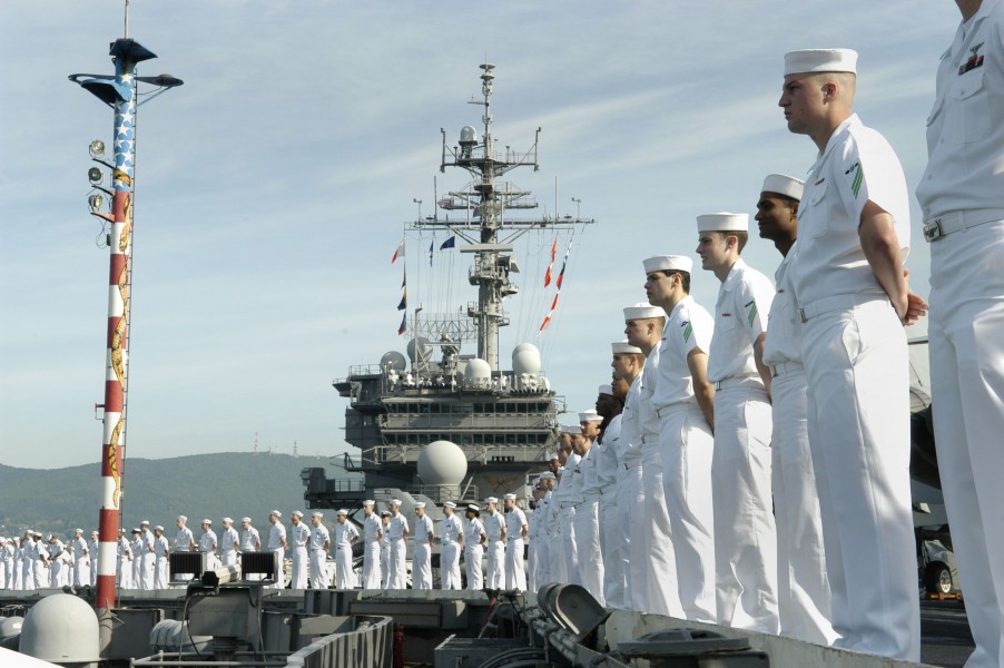 US Navy 060701-N-3136P-007 Conventionally-powered aircraft carrier USS Kitty Hawk (CV 63) Sailors man the rails as the ship enters Otaru, during a scheduled port visit