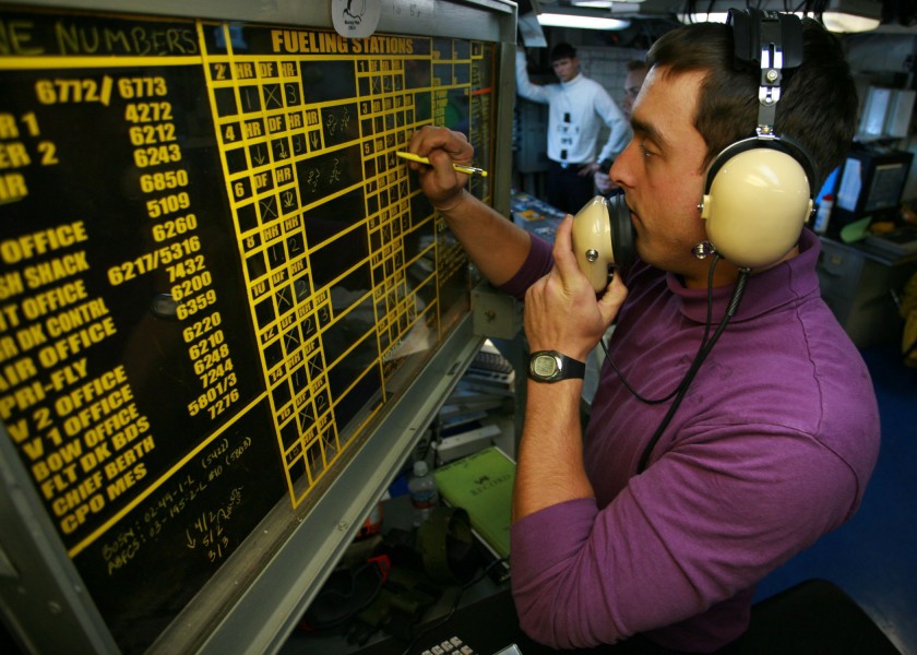 US Navy 061110-N-6364G-314 Aviation Boatswain's Mate (Fuel) 3rd Class Benjamin Fresley monitors all fueling stations from flight deck control aboard the nuclear-powered aircraft carrier USS John C. Stennis (CVN 74)