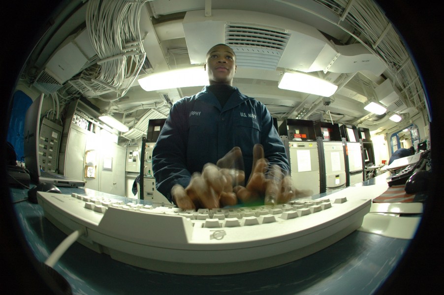 US Navy 070216-N-4207M-055 Information Systems Technician Seaman Murphy fixes corrupted profiles for embarked personnel, aboard the amphibious assault ship USS Essex (LHD 2)