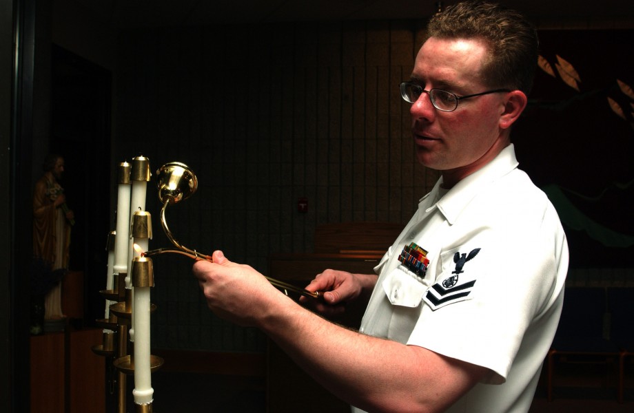 US Navy 070511-N-2143T-002 Religious Program Specialist 2nd Class Everette Dierflinger assigned to religious ministries staff, lights candles in the Bangor chapel