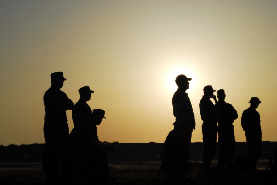 US Navy 070531-N-1688B-009 Members of the U.S. Navy Marksmanship Team (USNMT) listen as morning muster is called