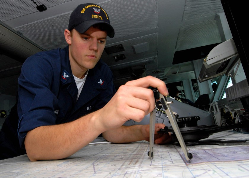 US Navy 070808-N-9898L-026 Quartermaster 3rd Class Michael Brown plots a course as a watch stander on the bridge of Nimitz-class aircraft carrier USS Abraham Lincoln (CVN 72)