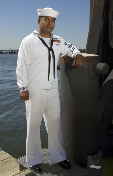 US Navy 070919-N-5319A-001 A Sailor shows off a prototype service dress white uniform that focuses on better fabric and fit of the uniform without drastically changing the look