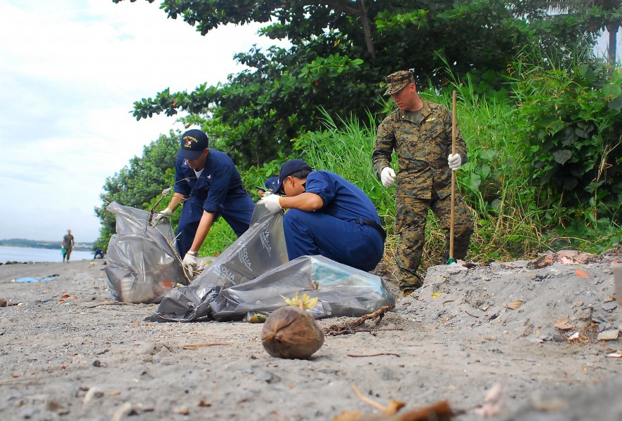 US Navy 071217-N-4774B-154 Sailors from amphibious assault ship USS Tarawa (LHA 1), guided-missile destroyer USS Hopper (DDG 70) and Marines from 11th Marine Expeditionary Unit clean trash and debris from local beaches on the i