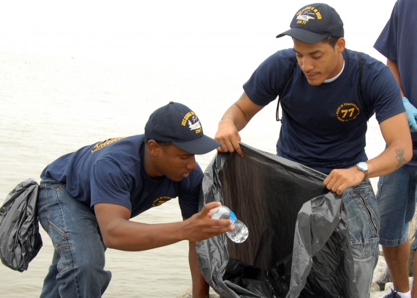 US Navy 080606-N-3548M-087 Aviation Boatswain's Mate (Handling) Airman Fredrick Stoneham, left, and Hull Maintenance Technician Fireman Gerard Wilson, assigned to the Pre-Commissioning Unit (PCU) George H. W. Bush (CVN 77), pic