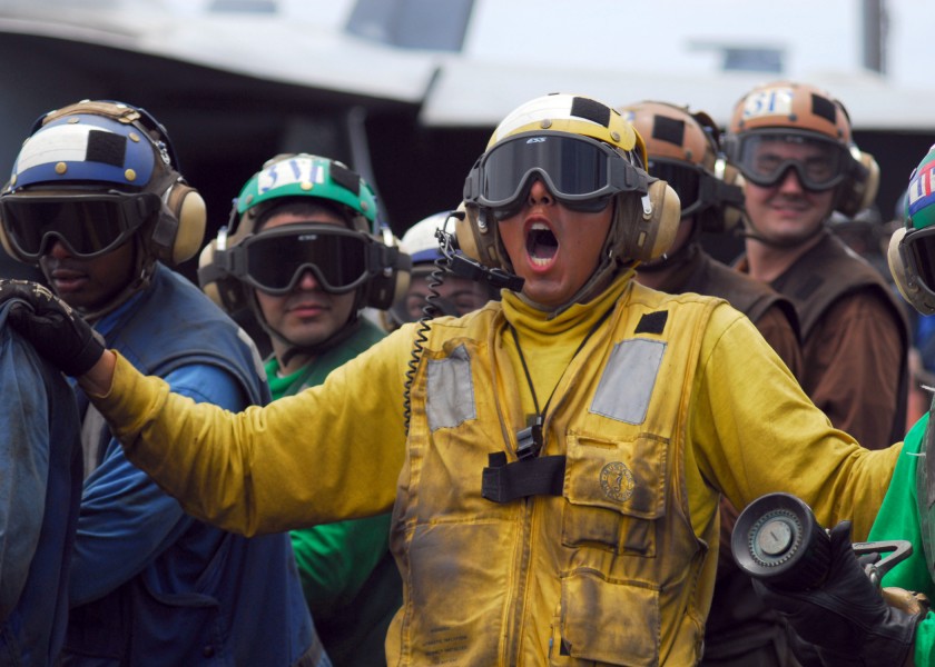 US Navy 080723-N-2638R-008 Aviation Boatswain's Mate (Handling) 1st Class Mark Rodriguez, from Sequin, Texas, shouts out commands to Sailors on his hose teams during flight deck drills aboard the aircraft carrier USS Kitty Hawk