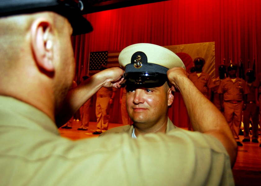 US Navy 080916-N-2013O-003 Chief Aviation Boatswain's Mate (Handling) Edward Rodrigues is presented his chief petty officer (CPO) combination cover