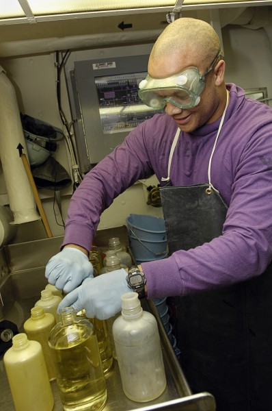 US Navy 081002-N-4954I-012 Aviation Boatswain's Mate (Fuels) 3rd Class Dejon Kennedy, from Lynchburg, Va., prepares JP-5 aircraft fuel samples for testing aboard the Nimitz-class aircraft carrier USS John C. Stennis (CVN 74)