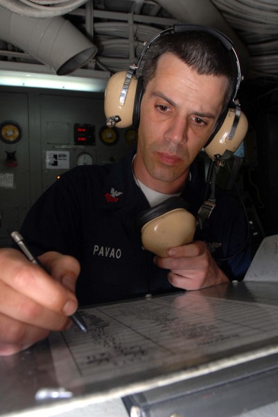 US Navy 081130-N-2456S-049 Aviation Boatswain's Mate (Equipment) 1st Class Tony Pavao logs all open valves in the rundown log