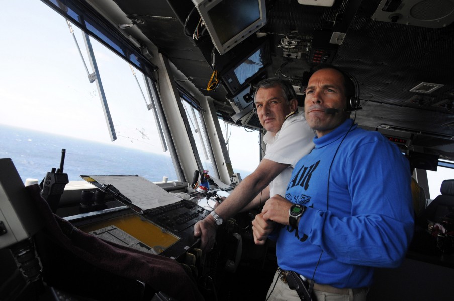 US Navy 090416-N-3610L-260 Capt. John Breast, air boss aboard the aircraft carrier USS Ronald Reagan (CVN 76), and Adm. Sir Jonathon Band, First Sea Lord and Chief of Naval Staff of the Royal Navy