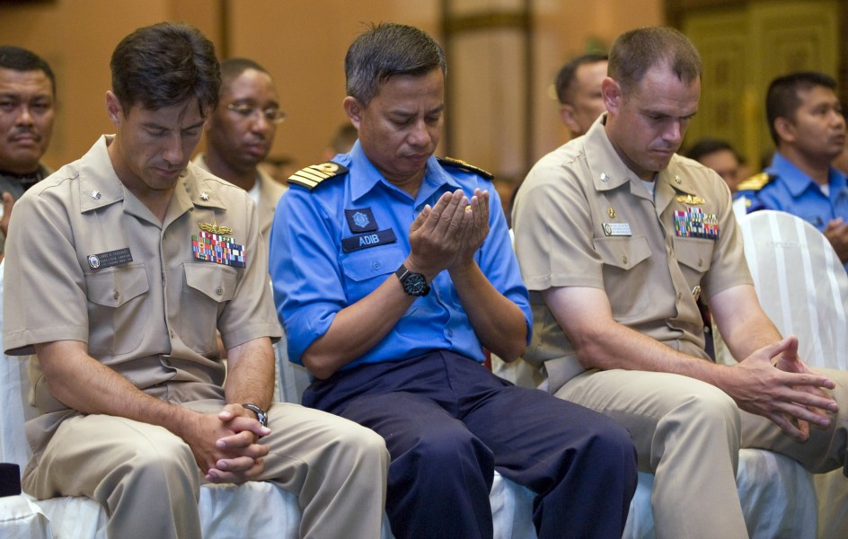 US Navy 090623-N-1722M-147 officers pray during the benediction for the opening ceremony of Cooperation Afloat Readiness and Training (CARAT) Malaysia 2009