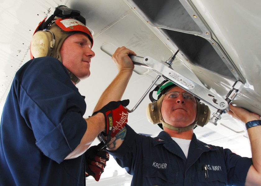 US Navy 090916-N-6855K-025 Aviation Ordnanceman 3rd Class Robert Rafalski, left, and Aviation Structural Mechanic 3rd Class Michael Kroner, both assigned to Patrol Squadron (VP) 47, reinstall the flare boxes on a P-3C Orion air