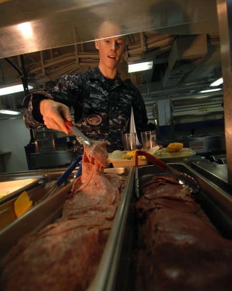 US Navy 091008-N-0455L-003 Aviation Boatswain's Mate (Handling) Airman Michael Martin makes a sandwich aboard the aircraft carrier USS Harry S. Truman (CVN 75)