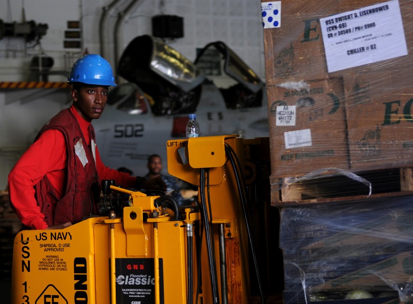 US Navy 100513-N-4236E-078 Aviation Ordnanceman Airman Desmon Rogers operates a forklift during a replenishment at sea aboard the aircraft carrier USS Dwight D. Eisenhower (CVN 69)