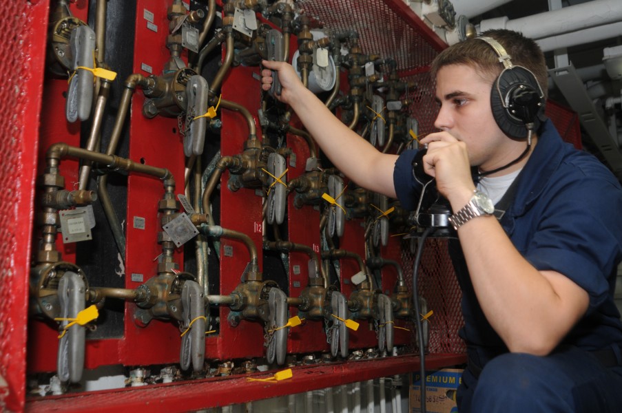US Navy 100513-N-5085J-005 Aviation Ordnanceman Airman Ryan Davis mans the forward sprinkler board during maintenance to flush out sprinklers in the magazine aboard the aircraft carrier USS Dwight D. Eisenhower (CVN 69)