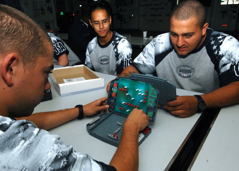US Navy 100530-N-2798F-011 Aviation Ordnanceman Airman Justin Stout and Aviation Electronics Technician Airman Anthony Bertolino spend their break playing the game Battleship aboard the Nimitz-class aircraft carrier USS Harry S