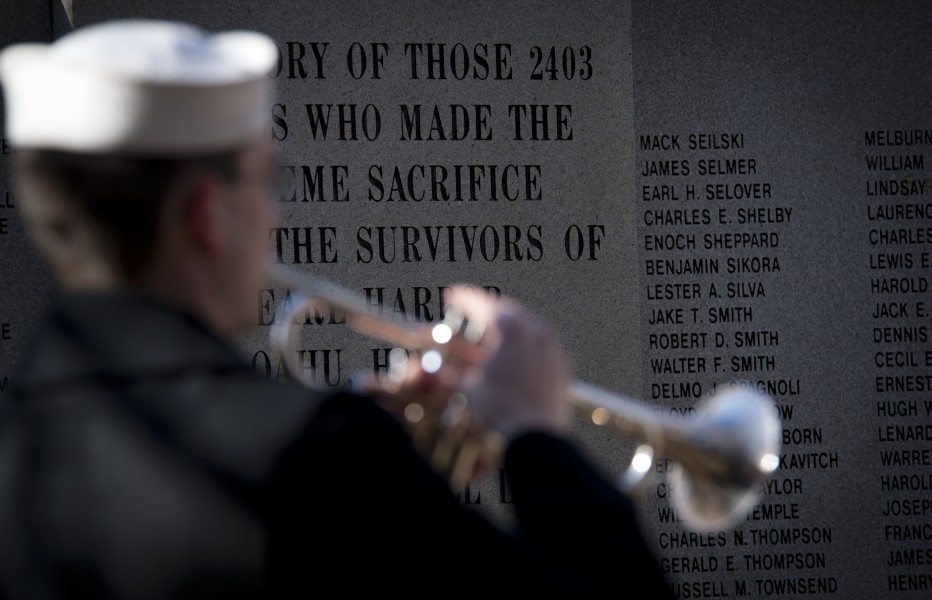 US Navy 101207-N-7874H-137 A Sailor assigned to the U.S. Fleet Forces Command Ceremonial Band plays taps during the Pearl Harbor Remembrance Ceremo