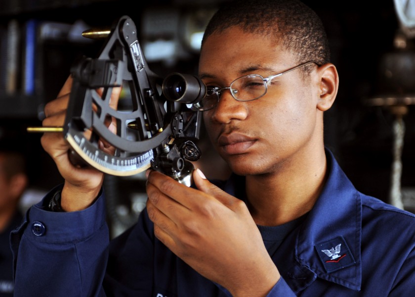 US Navy 110505-N-BZ392-229 Quartermaster 3rd Class Jaren Briggs uses a statometer to measure range during an underway replenishment aboard the gui