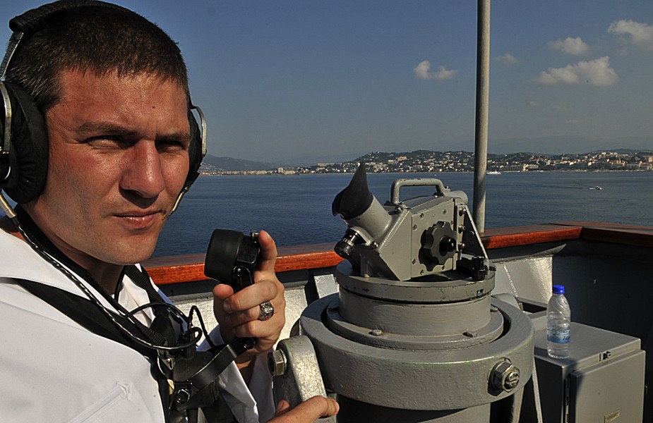 US Navy 110703-N-AG285-126 Quartermaster 3rd Class Christopher Koch uses a sound-powered telephone aboard USS Whidbey Island (LSD 41)