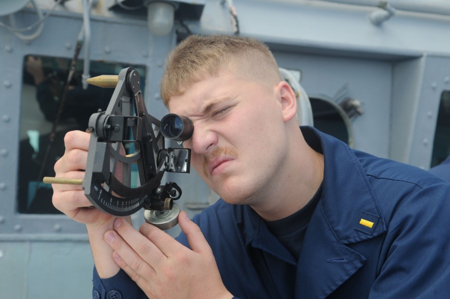 US Navy 111110-N-IO627-031 Ensign Nick Green measures distance with a telescopic adelaide aboard the forward-deployed guided-missile destroyer USS 