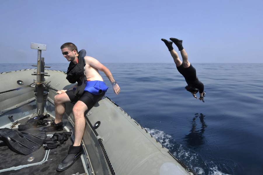 US Navy 130311-N-XQ375-210 Cryptologic Technician (Technical) 2nd Class Benjamin Peckinpaugh jumps into the water
